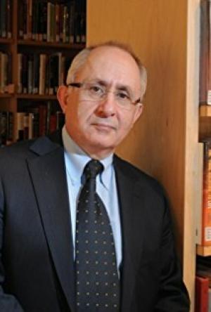 Танер Акчам